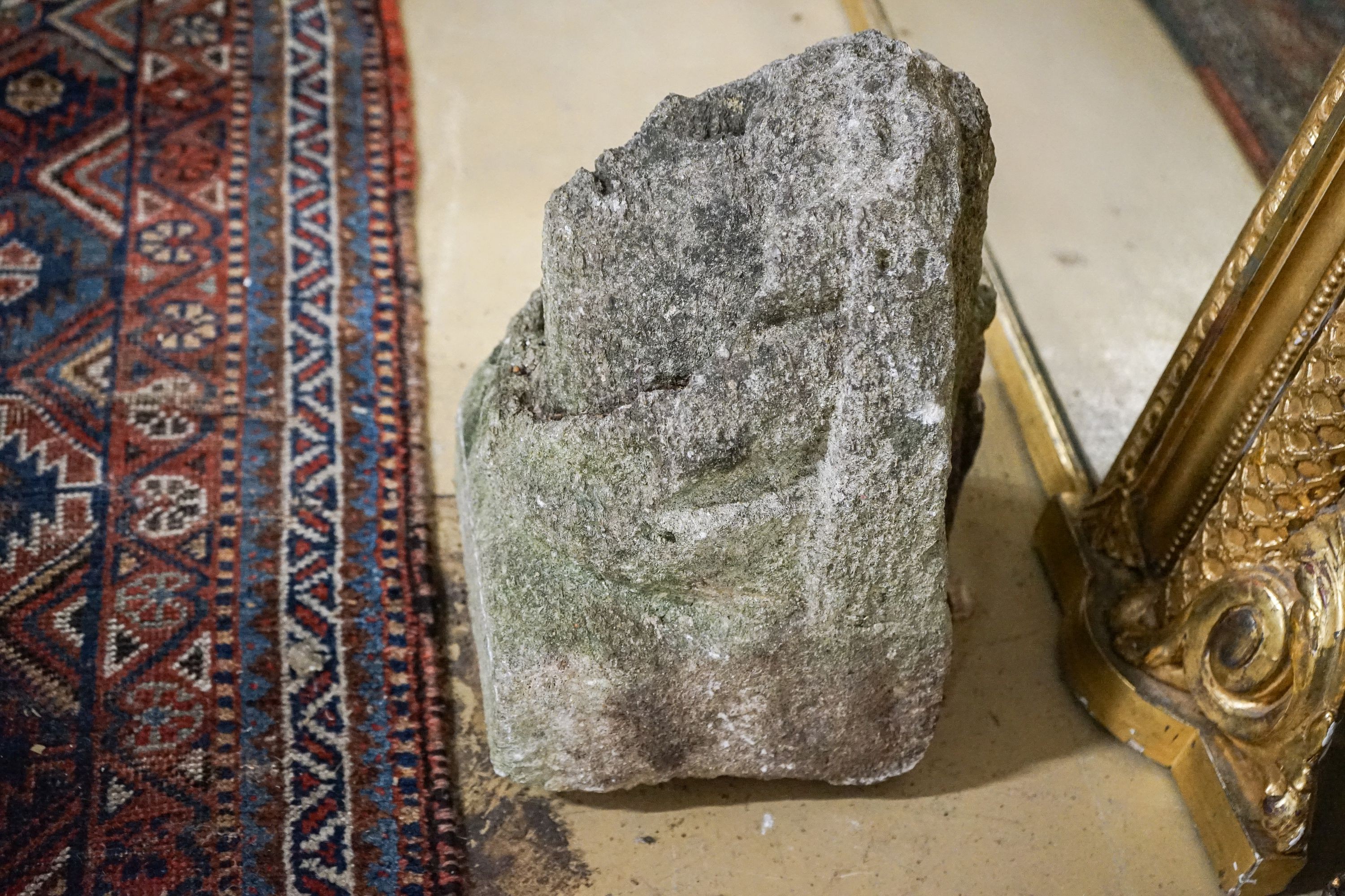 An antique carved stone corbel, width 30cm, height 28cm